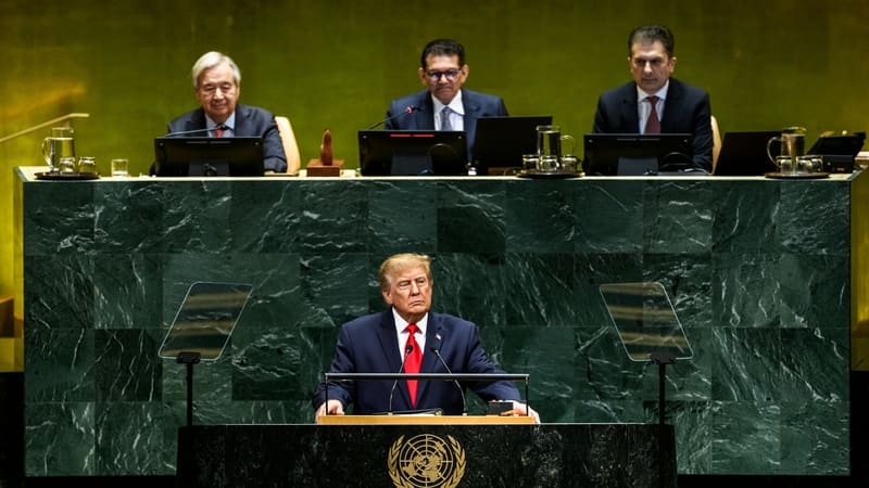 Donald Trump speaks from the UN General Assembly podium, with UN Secretary-General Guterres seated behind him.