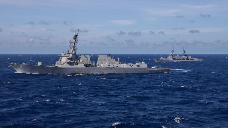 U.S. destroyer USS Sterett and Philippine patrol vessel BRP Andres Bonifacio sail on open sea