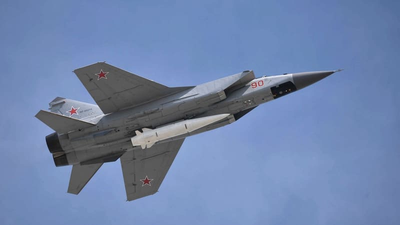 Russian MiG-31K jet in flight with a Kinzhal missile slung under its fuselage