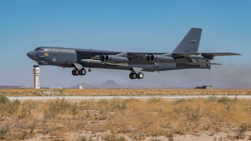 B-52H bomber taking off from a desert runway with AGM-183A test rounds under its wing