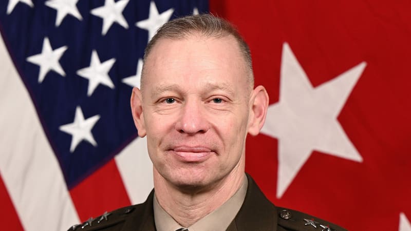 Official portrait of U.S. Army Lt. Gen. Brett G. Sylvia in uniform in front of the U.S. flag
