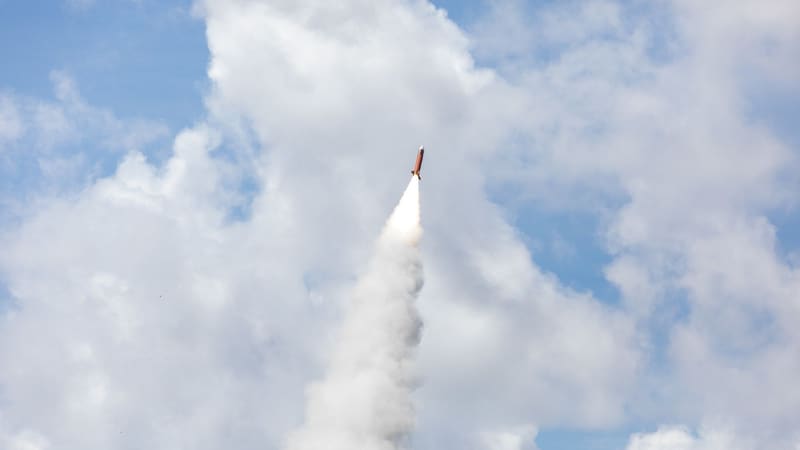 A Patriot interceptor missile climbing on a white smoke trail into a cloudy sky after launch.