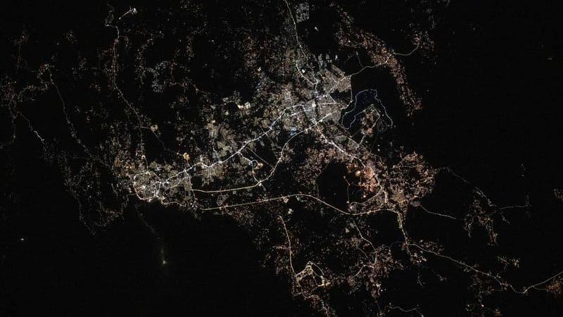 Night view from orbit of the lit-up urban sprawl of Abha, Khamis Mushait and Ahad Rafidah in southwestern Saudi Arabia
