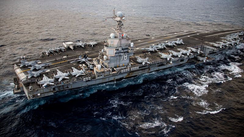 Aerial view of aircraft carrier USS Gerald R. Ford, hull number 78 on its island, under way with jets on its flight deck