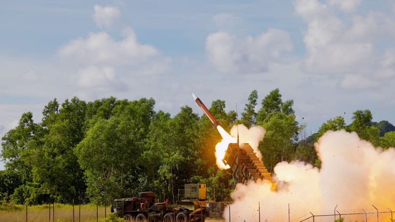 Patriot interceptor leaving its launcher in a burst of flame and smoke