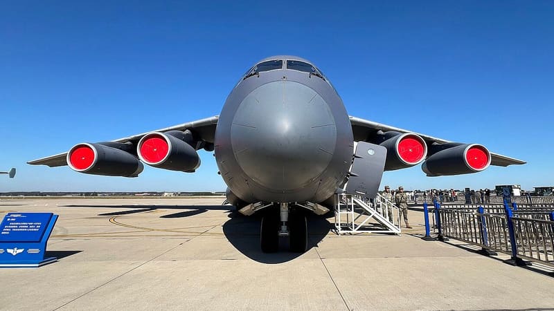 Head-on view of a grey Y-20A four-engine transport aircraft on static display at an airshow