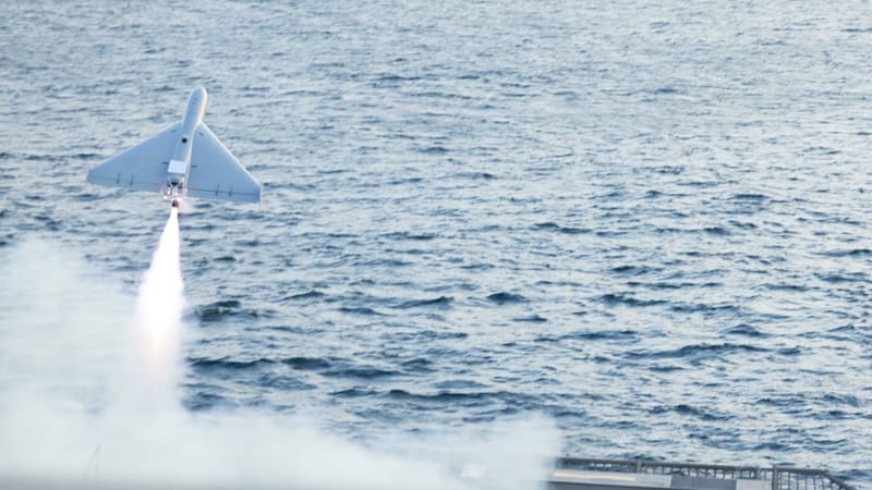 A LUCAS one-way attack drone climbs on its rocket booster after launch from USS Santa Barbara over the Arabian Gulf