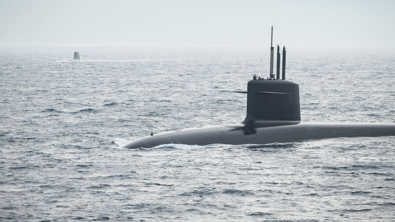 A French Le Triomphant-class ballistic-missile submarine surfaced at sea off Brest, a second submarine on the horizon