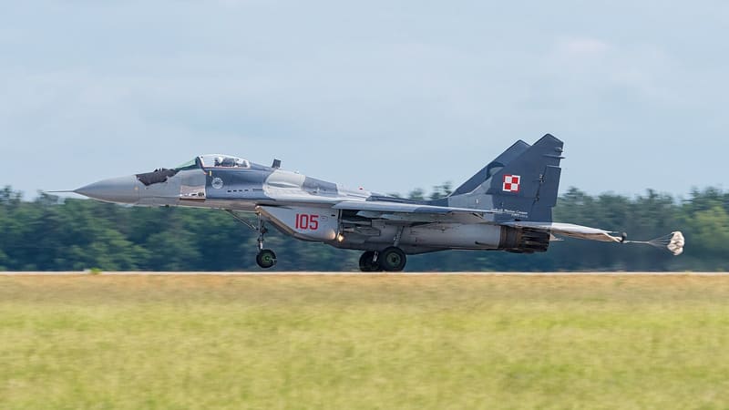 Polish Air Force MiG-29A with serial 105 rolling down a runway with its brake parachute deployed