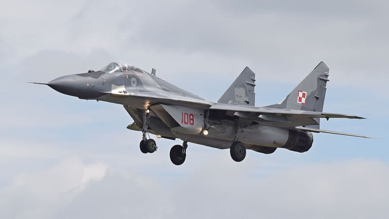 Polish Air Force MiG-29A with serial 108 approaching to land with its undercarriage down under a cloudy sky