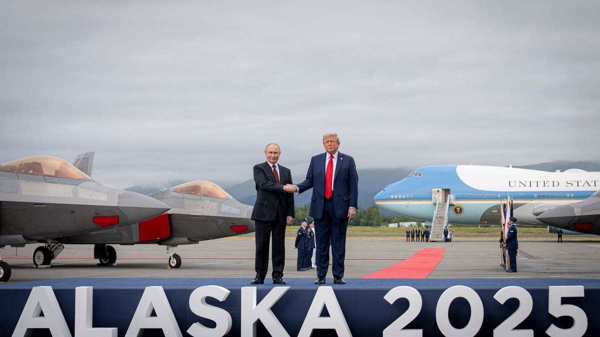 Trump and Putin shake hands on an Alaska airfield beside fighter jets and Air Force One