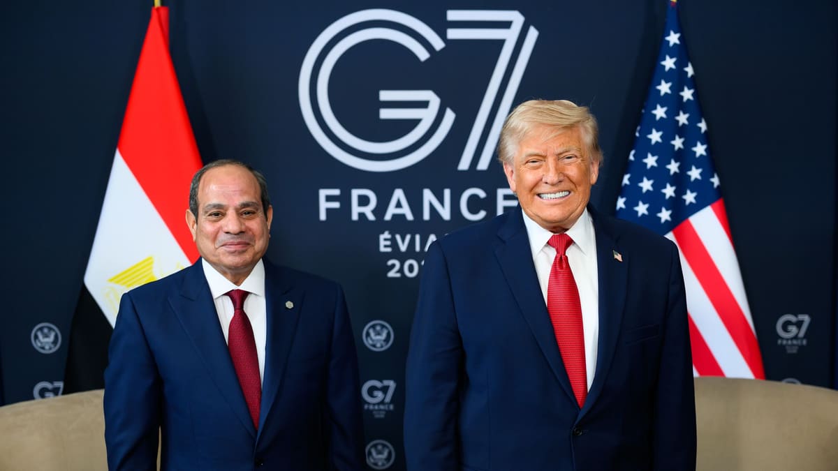 Egyptian President Sisi, left, and US President Trump stand smiling before Egyptian and US flags and a G7 France backdrop