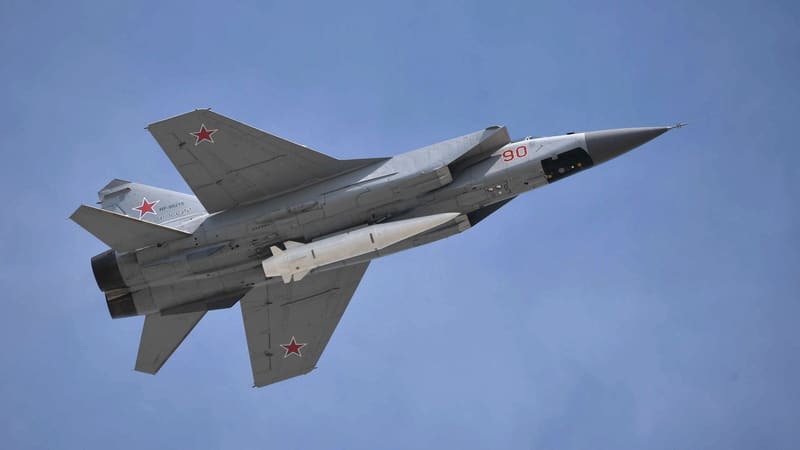 Russian MiG-31K fighter in flight carrying a Kh-47M2 Kinzhal missile under its fuselage