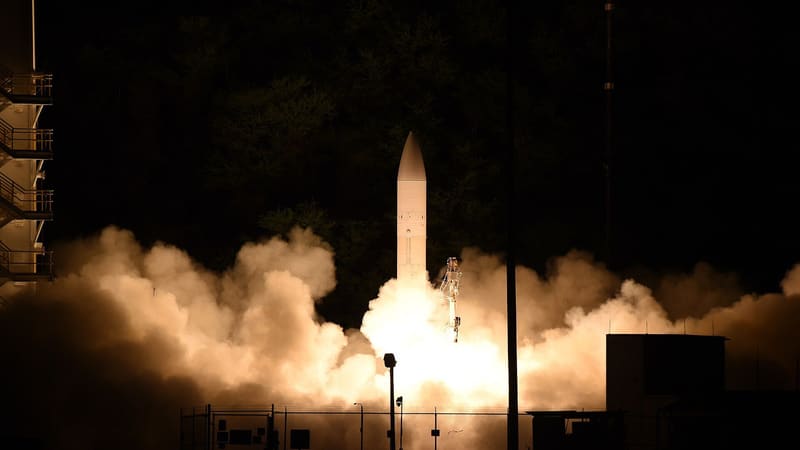 Night launch of the U.S. Common Hypersonic Glide Body test missile amid exhaust smoke in Hawaii