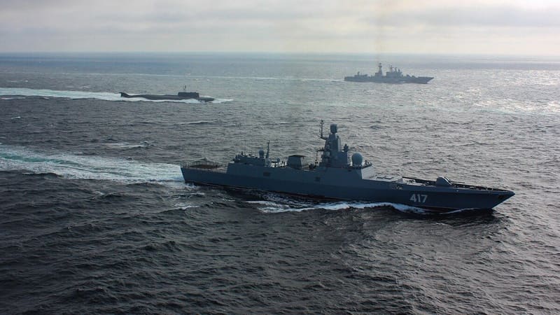 The Russian frigate Admiral Gorshkov, hull number 417, at sea with a submarine and a destroyer behind it